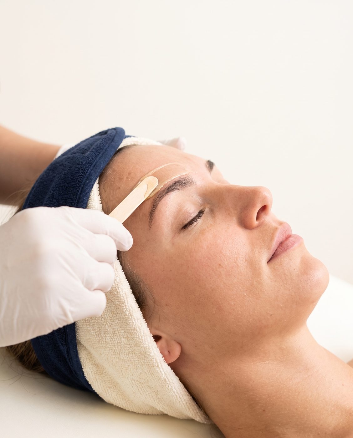 Brow waxing in progress